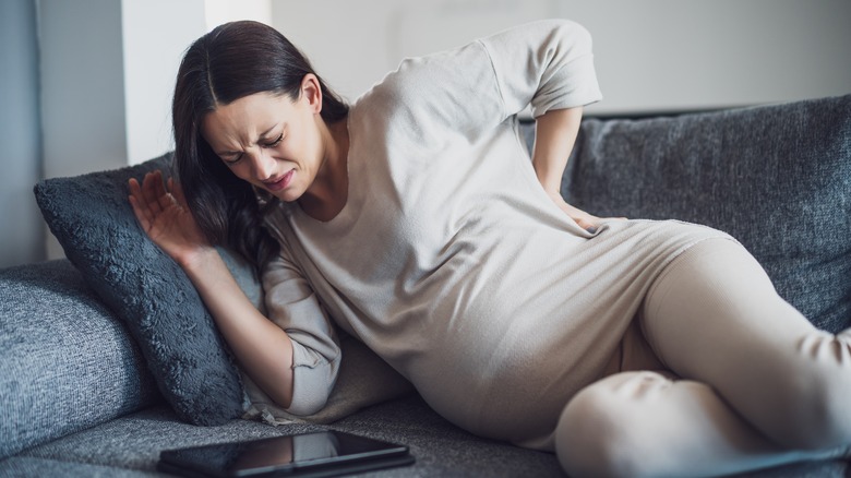 Pregnant woman experiencing lower back pain