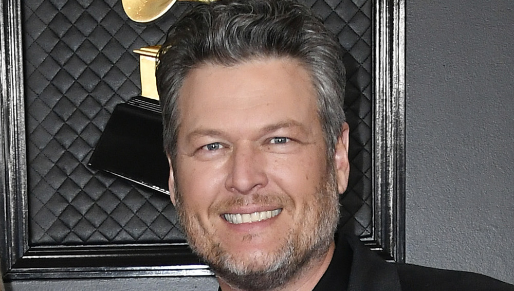 Blake Shelton smiling on red carpet