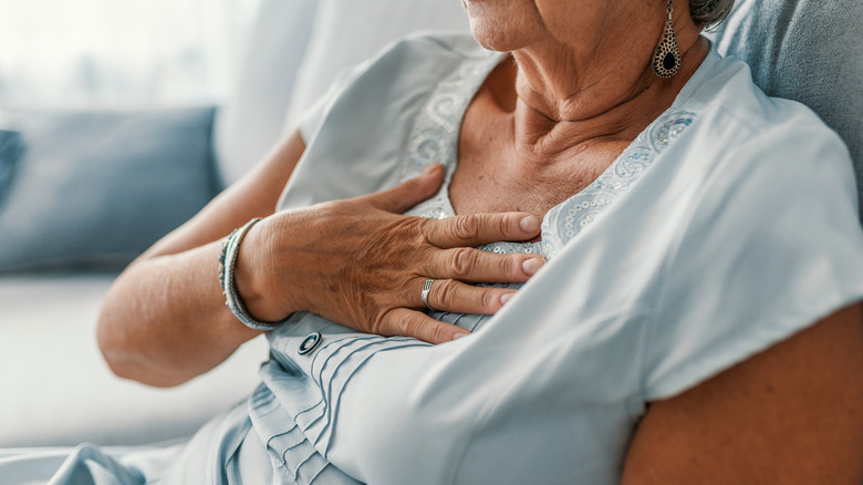 Woman experiencing heart pain 