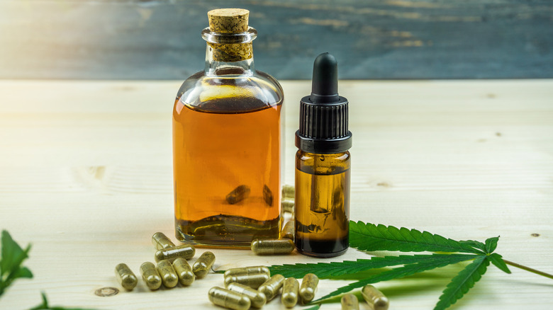 CBD oil and capsules on a table