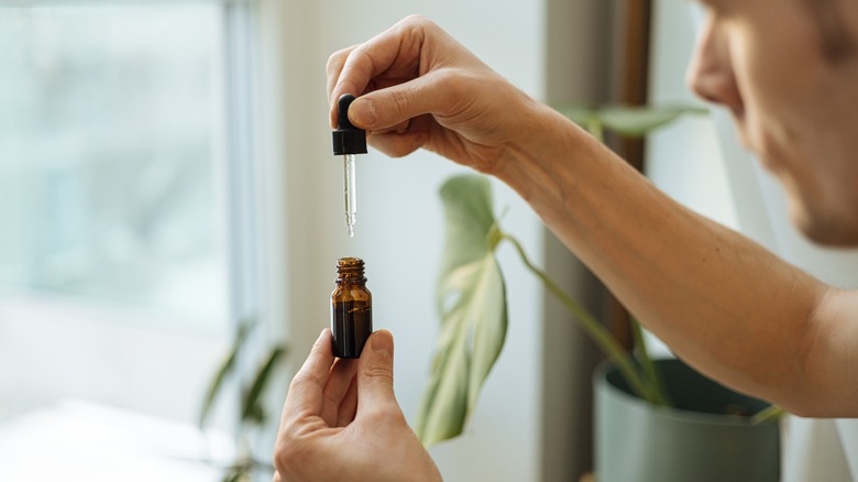 man using CBD oil