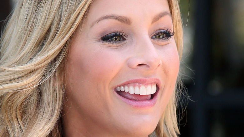 Clare Crawley smiles at an event