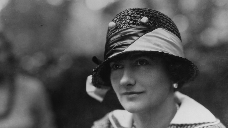 Gabrielle Coco Chanel posing