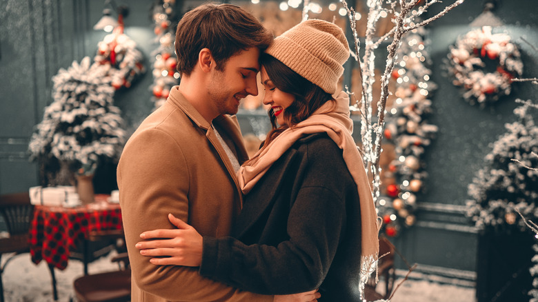 young couple outside during the holidays