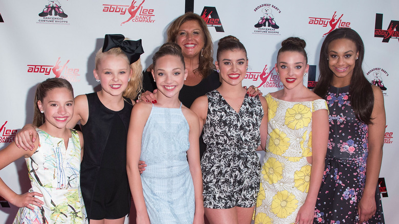 Abby Lee Miller poses with studio dancers