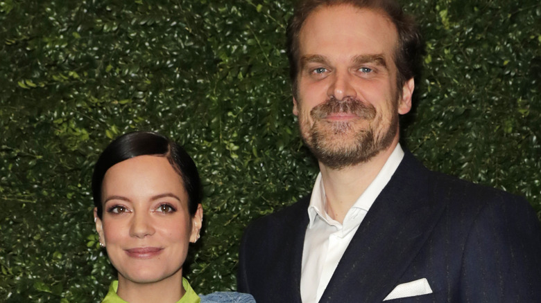 Lily Allen and David Harbour pose for a picture at an event