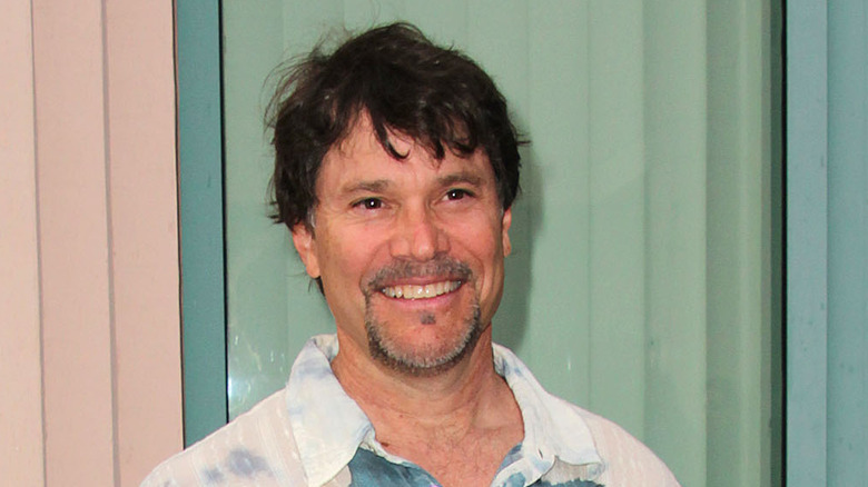 Peter Reckell smiles at an event. 