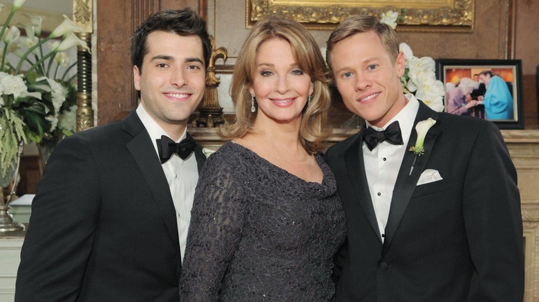 Will and Sonny posing with Marlena at wedding