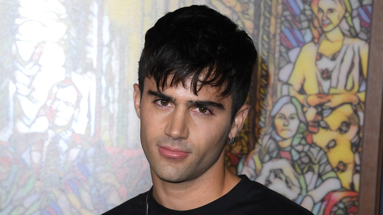Max Ehrich with unimpressed expression