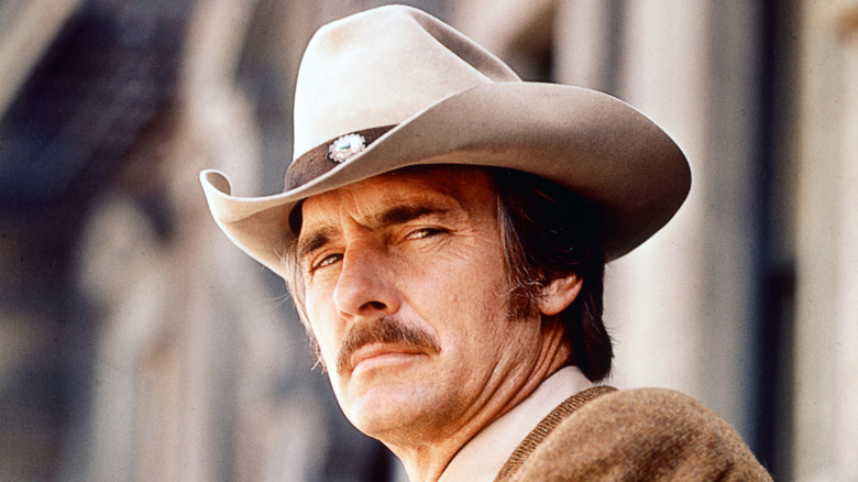 Dennis Weaver wearing a cowboy hat