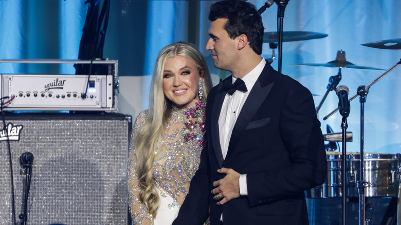Erica Kirk and Charlie Kirk smiling at event