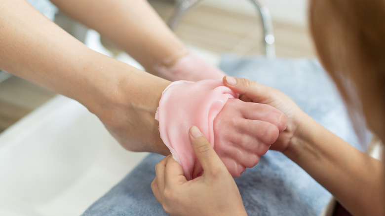 paraffin wax being peeled off a foot