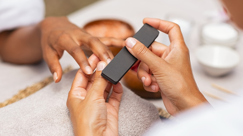 woman getting manicure 