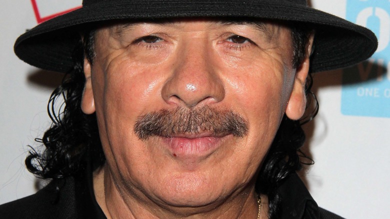 Carlos Santana posing 