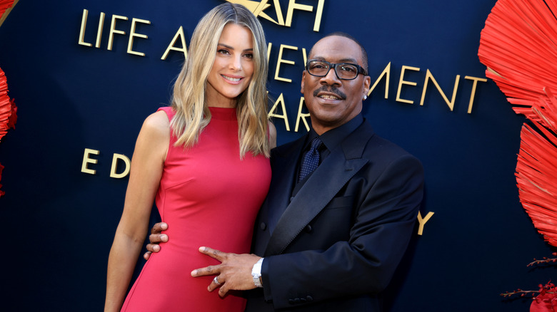 Paige Butcher and Eddie Murphy attend the 51st AFI Life Achievement Award: A Tribute To Eddie Murphy at Dolby Theatre on April 18, 2026 in Hollywood, California