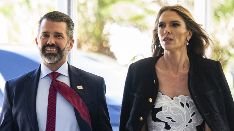 Donald Trump Jr. and Bettina Anderson walking