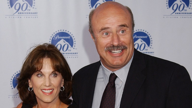Robin McGrawn and Dr. Phil McGraw attend a red carpet event in 2002.