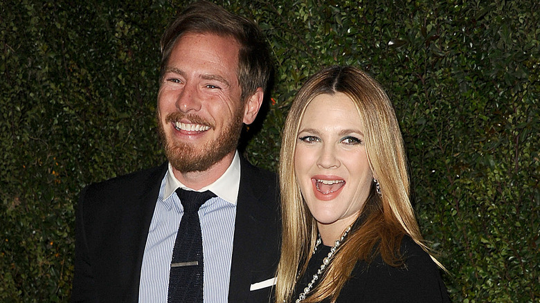 Drew Barrymore and Will Kopelman laughing together