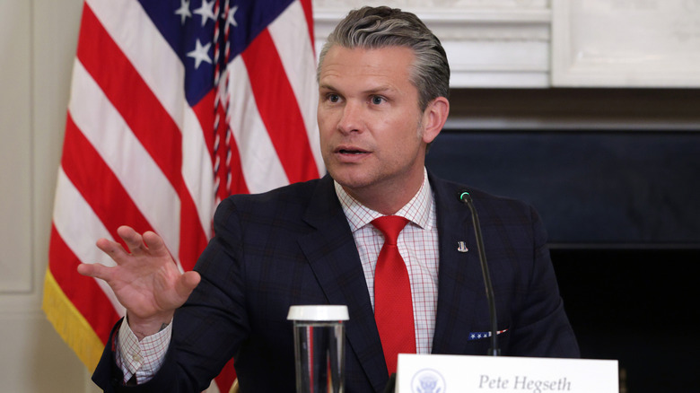 Pete Hegseth gesturing during meeting