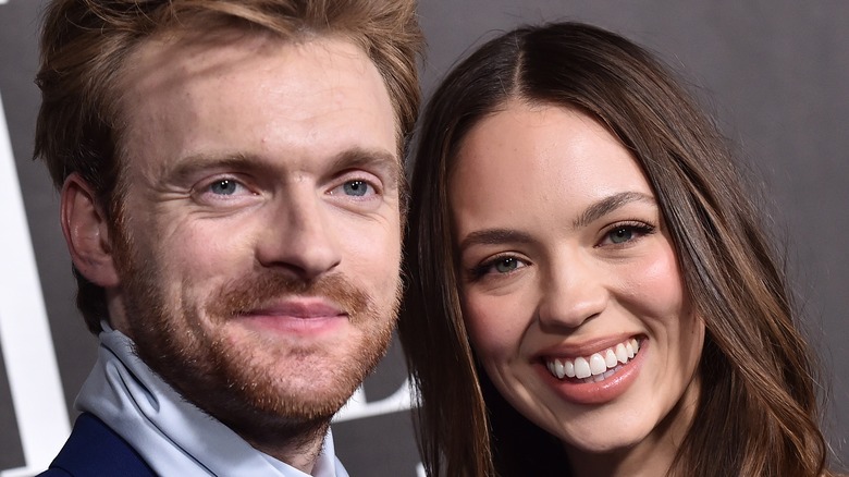 Finneas O'Connell and Claudia Sulewski smiling
