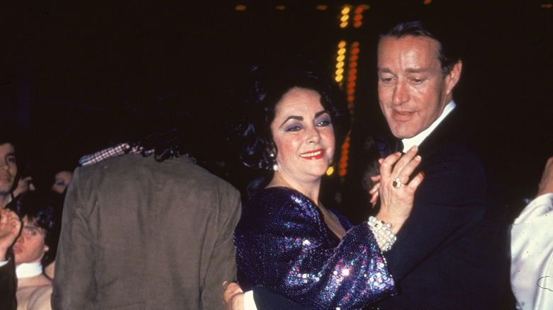 Roy Halston dancing with Elizabeth Taylor 