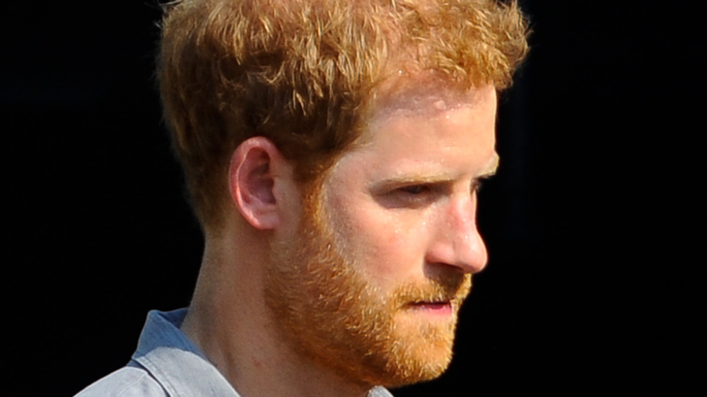 Prince Harry's profile, looking down