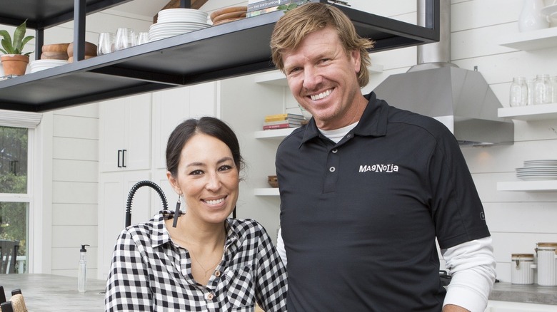 Chip and Joanna Gaines smiling in "Fixer Upper"