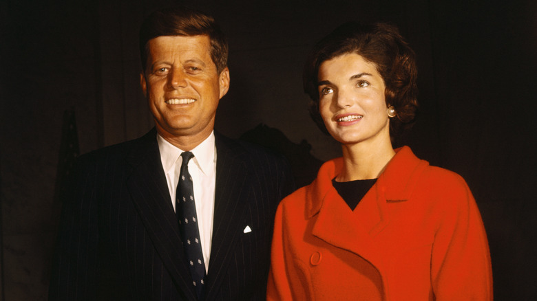 John F. Kennedy and Jackie Kennedy posing for photos
