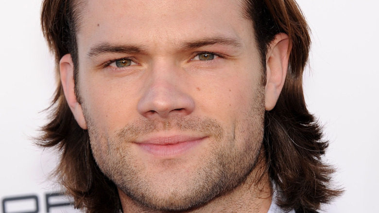 Jared Padalecki smiles for a photo. 