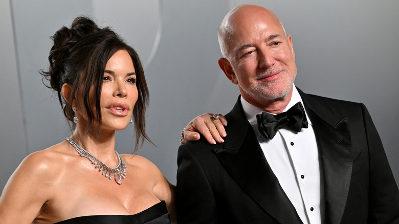 Lauren S&aacute;nchez and Jeff Bezos posing at the 2026 Vanity Fair Oscars afterparty