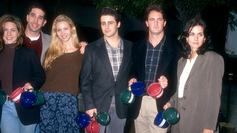 Cast of Friends poing together