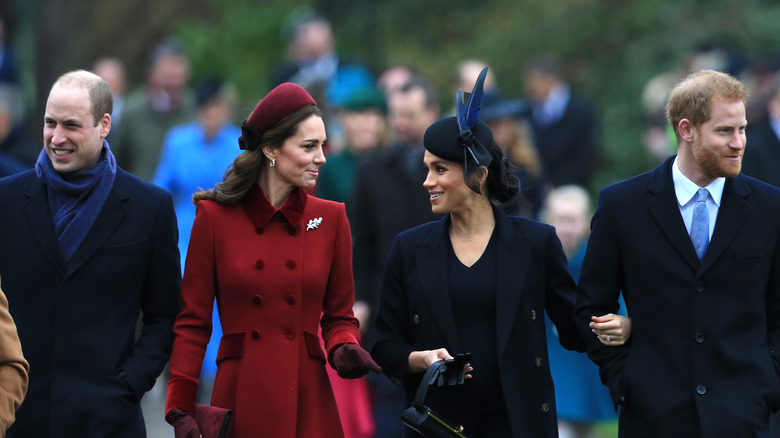 Princes William and Harry with their wives 