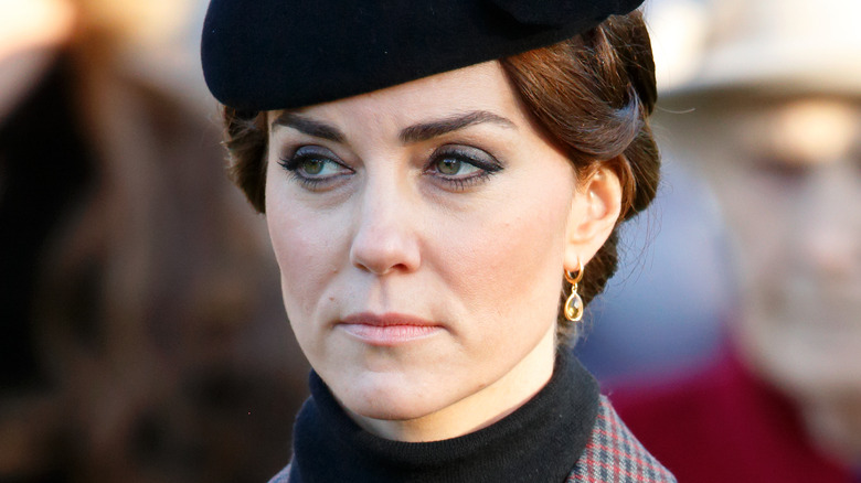 Kate Middleton with a neutral expression in close-up