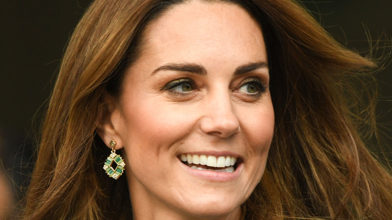 Kate Middleton smiles for a photo.