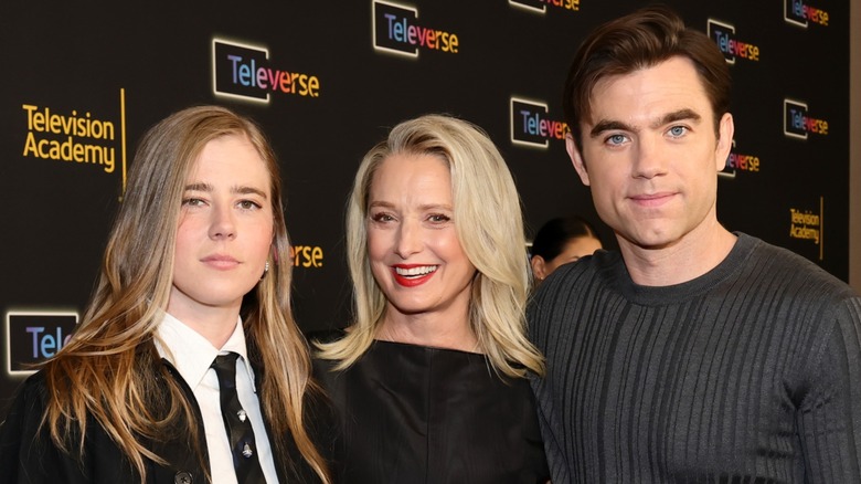 Taylor Dearden, Katherina LaNasa and Patrick Ball wearing dark clothing at a formal event.