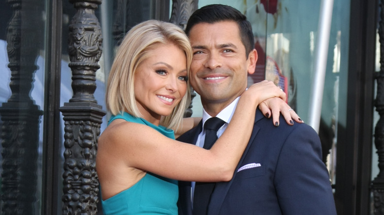 Kelly Ripa hugging Mark Consuelos