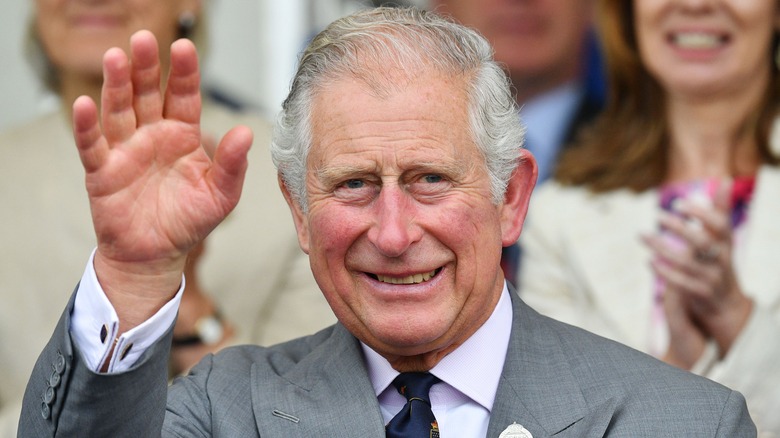 King Charles III waving