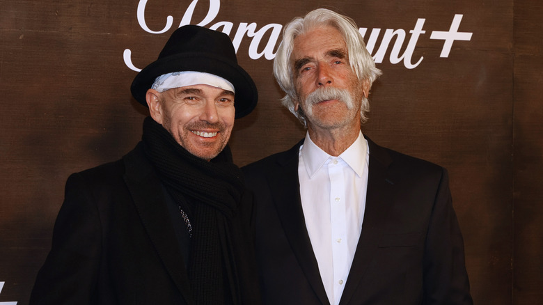 Billy Bob Thornton and Sam Elliott smiling for photos together in black and white outfits