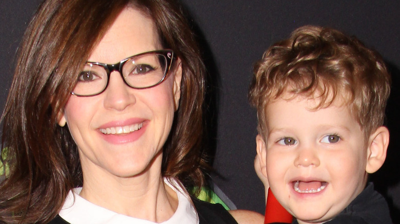 Lisa Loeb holding son