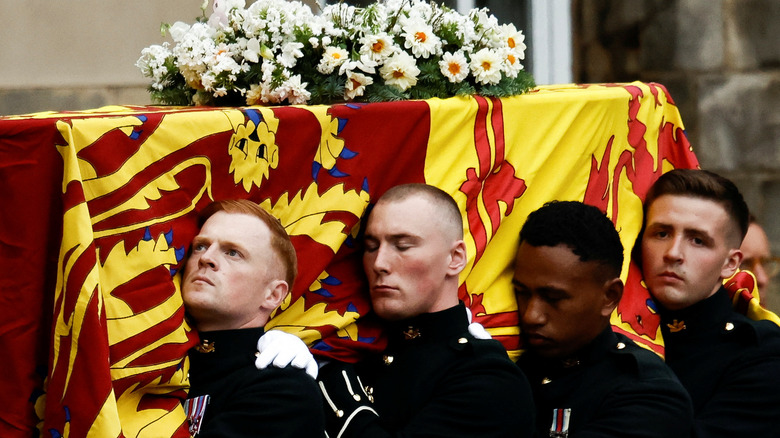 Pallbearers carry Queen Elizabeth's coffin