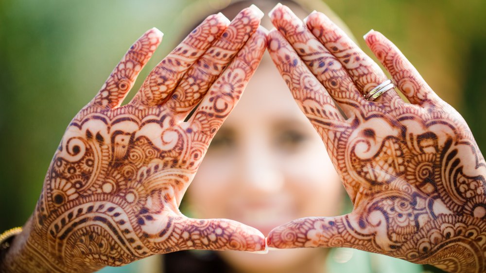 Woman with henna tattoos on hands