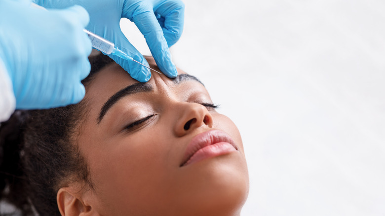 Woman getting Botox shot