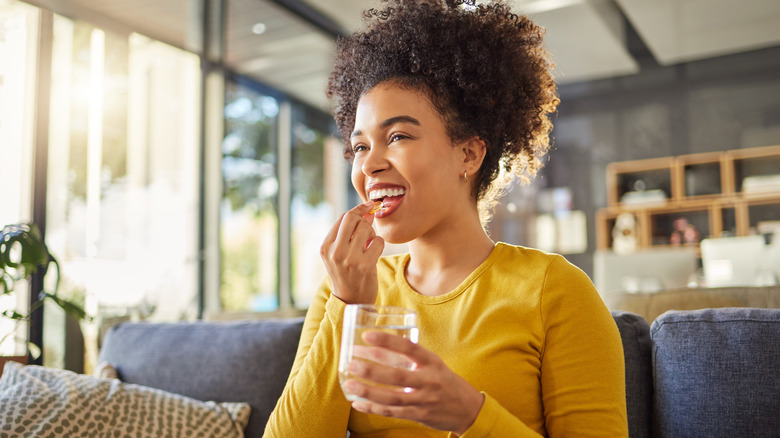 woman taking collagen supplements