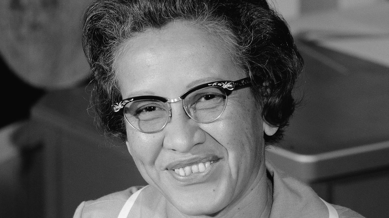 Katherine Johnson sitting at NASA desk 