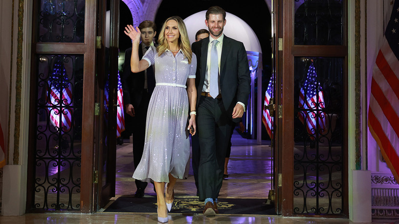 Eric and Lara Trump waving in formal attire