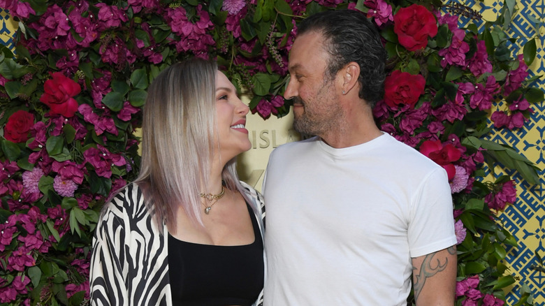 The couple looking at each other and smiling