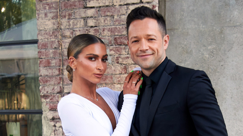 The couple looking at the camera