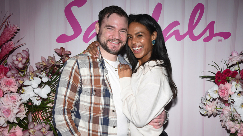 The couple looking at the camera