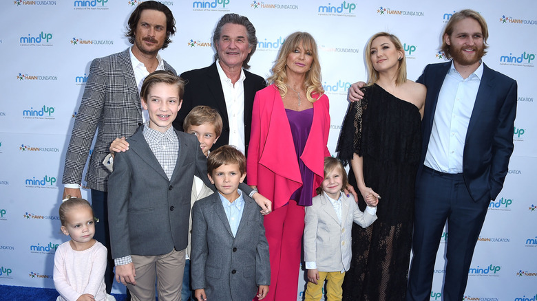 Kurt Russell and Goldie Hawn pose with family on the red carpet