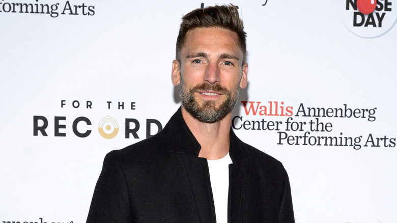 Andrew Walker posing on the red carpet